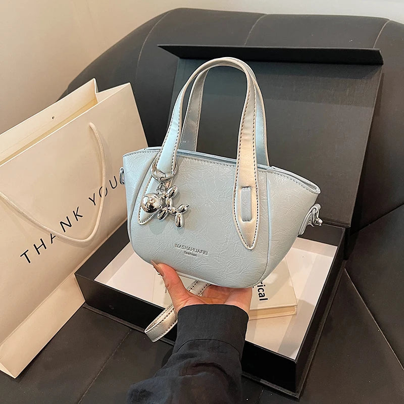 High end and niche solid color bag for women in 2024, new summer fashion crossbody bag, popular this year, portable bucket bag