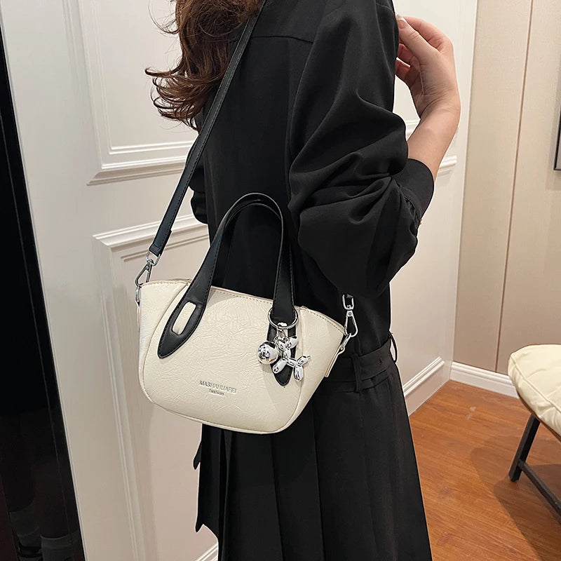 High end and niche solid color bag for women in 2024, new summer fashion crossbody bag, popular this year, portable bucket bag