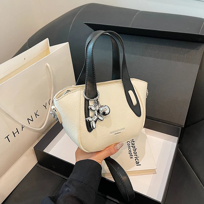 High end and niche solid color bag for women in 2024, new summer fashion crossbody bag, popular this year, portable bucket bag