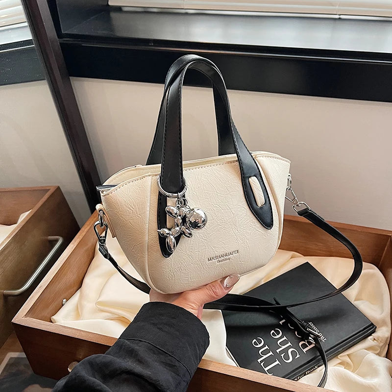 High end and niche solid color bag for women in 2024, new summer fashion crossbody bag, popular this year, portable bucket bag