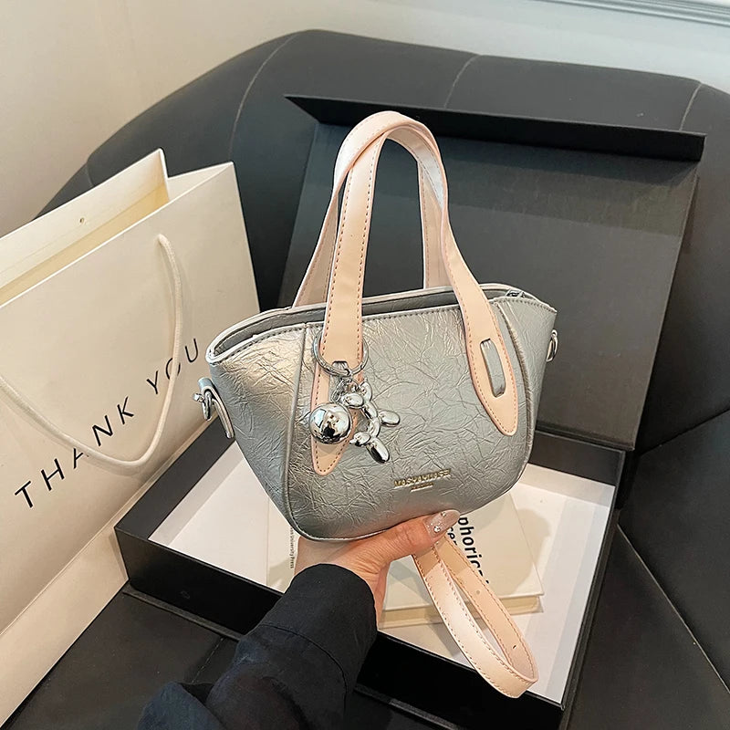 High end and niche solid color bag for women in 2024, new summer fashion crossbody bag, popular this year, portable bucket bag