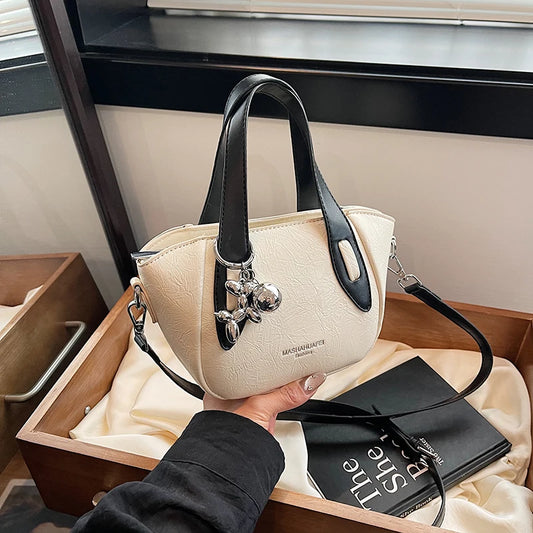 High end and niche solid color bag for women in 2024, new summer fashion crossbody bag, popular this year, portable bucket bag